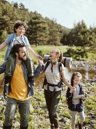 Visitors exploring marine life exhibits at Blue Planet Aquarium, Cheshire, UK.