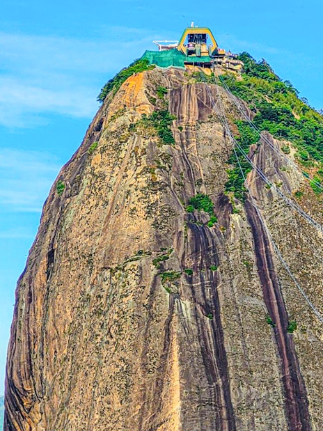 Sugarloaf Mountain peak with cable car station, Rio de Janeiro.