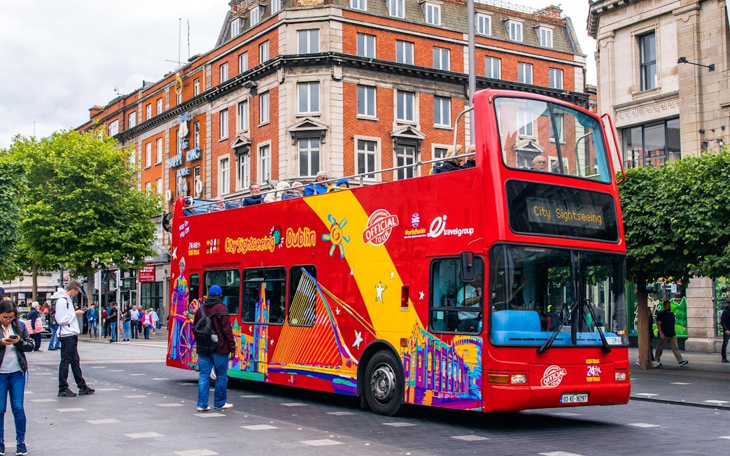Red double-decker bus for City Sightseeing tour in Dublin city center.