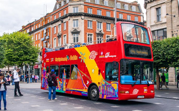 Red double-decker bus for City Sightseeing tour in Dublin city center.