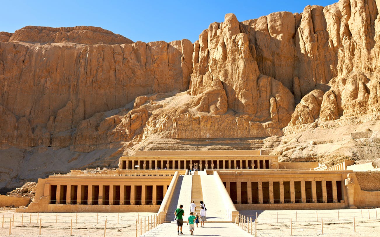 Valley of the Queens, Luxor, with tourists approaching Hatshepsut Temple.