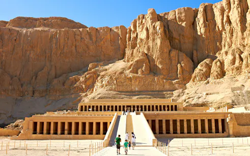 Valley of the Queens, Luxor, with tourists approaching Hatshepsut Temple.