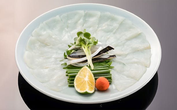 Puffer fish sashimi with garnish at Torafugu-tei Ginza.
