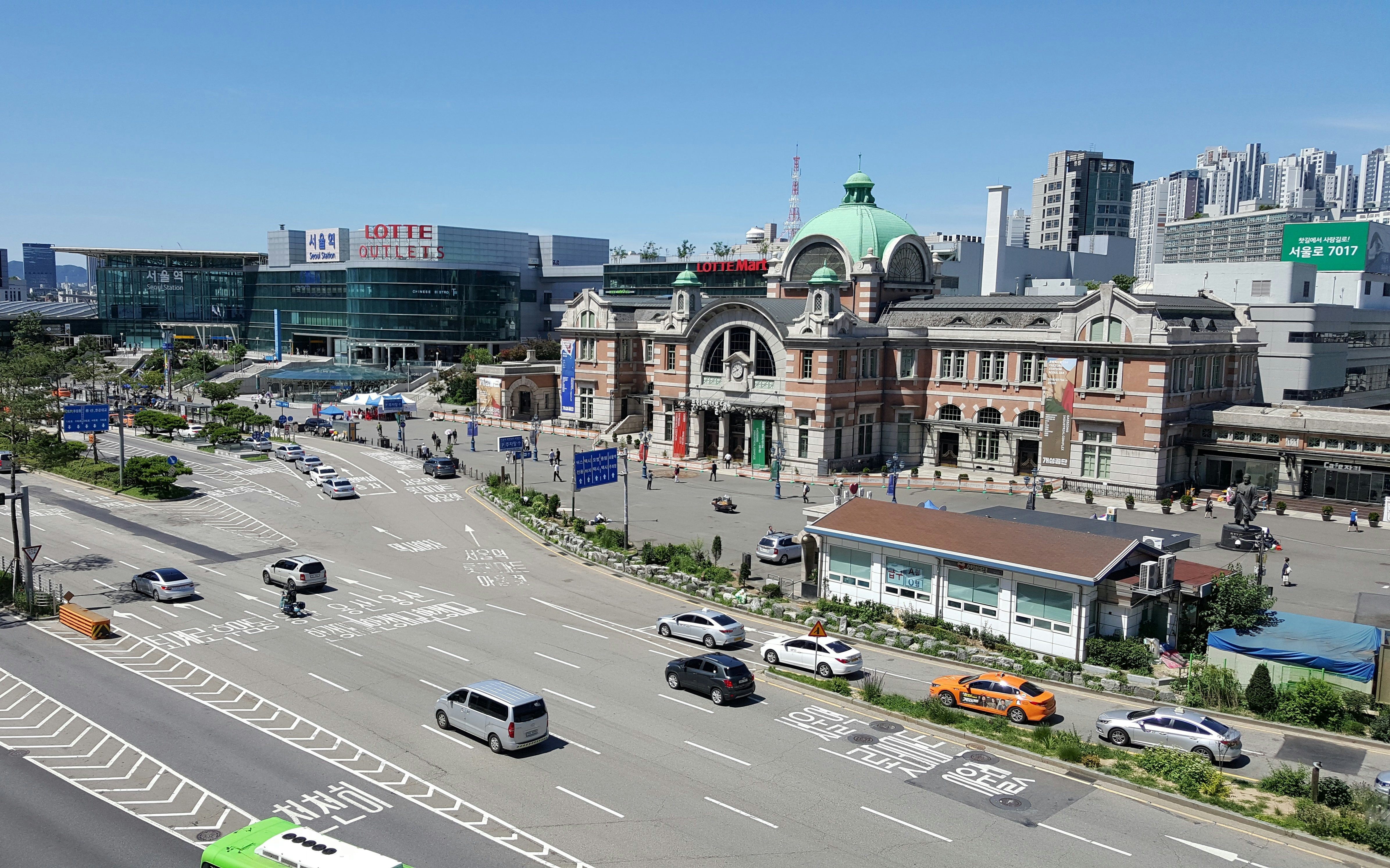 Seoul Station with historic architecture and nearby modern buildings.