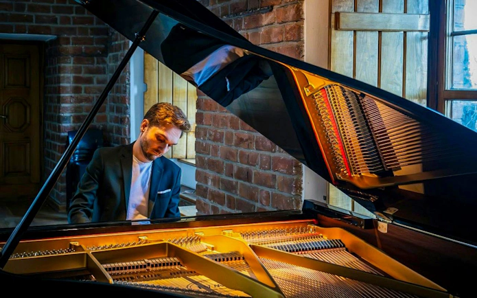Pianist performing at Chopin Concert, Royal Castle Complex, Warsaw.