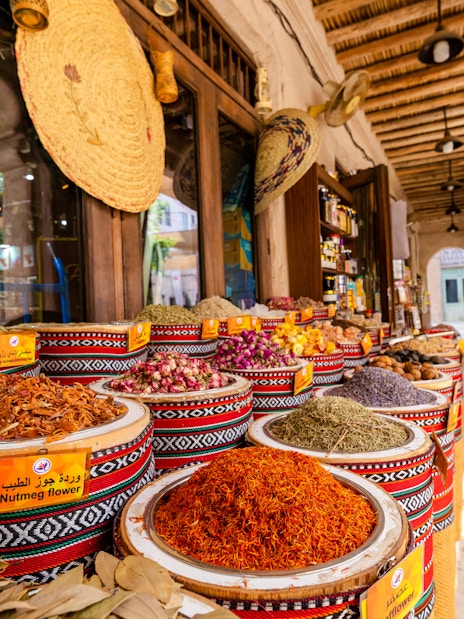 Fragrances and spices displayed in baskets at Spice Souk, Dubai.