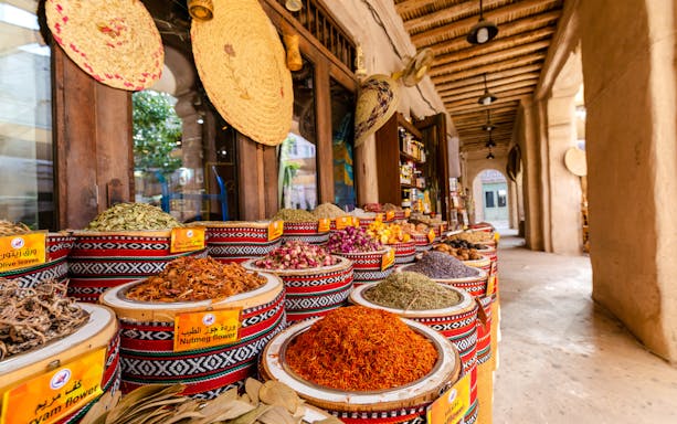 Fragrances and spices displayed in baskets at Spice Souk, Dubai.