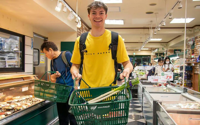 Shopping for ingredients in a Tokyo supermarket during an Izakaya-style cooking class.