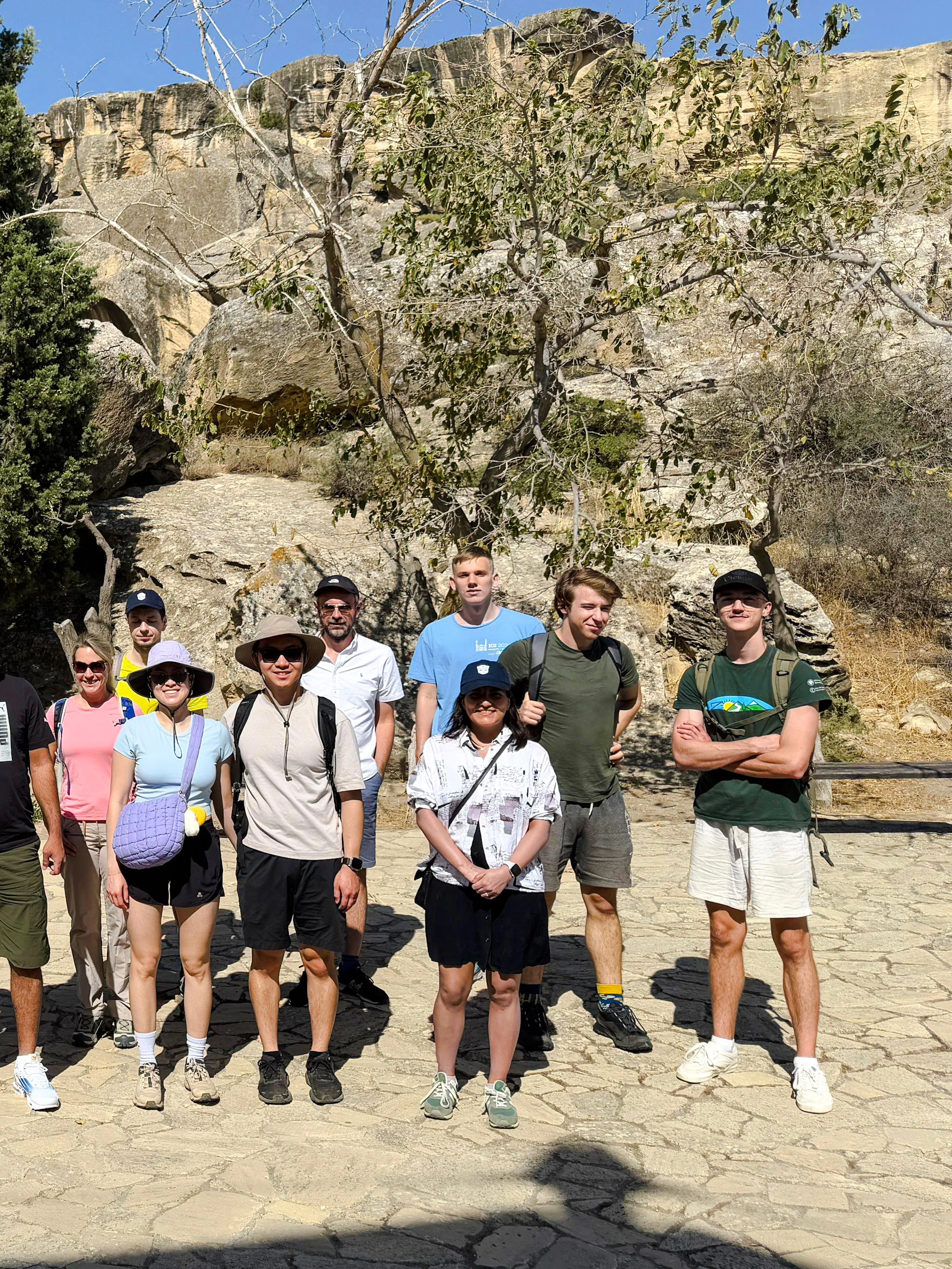 Group of tourists at Gobustan National Park with rocky landscape in Azerbaijan.