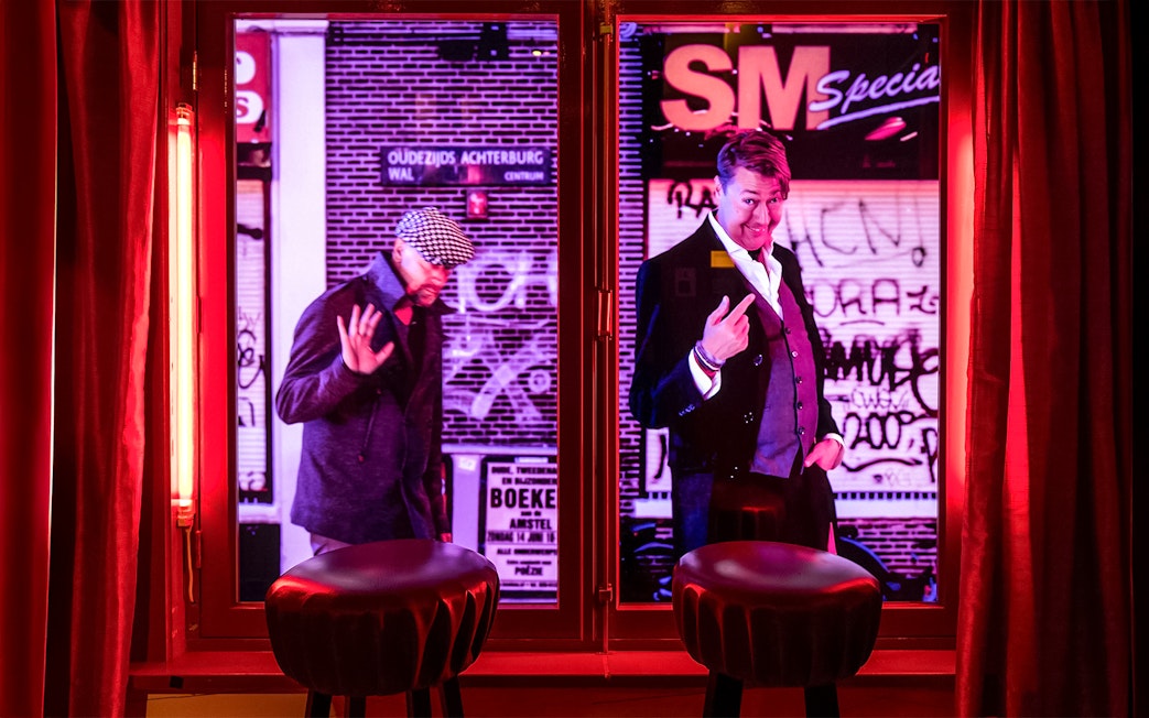 Two mannequins in a window display at Red Light Secrets Museum of Prostitution, Amsterdam.