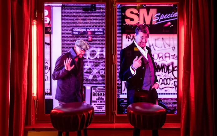 Two mannequins in a window display at Red Light Secrets Museum of Prostitution, Amsterdam.
