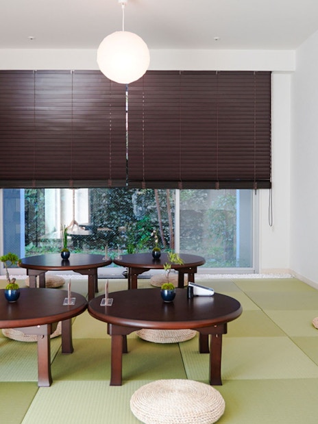 Tatami room setup for Tokyo Matcha & Kimono Experience with low tables and cushions.