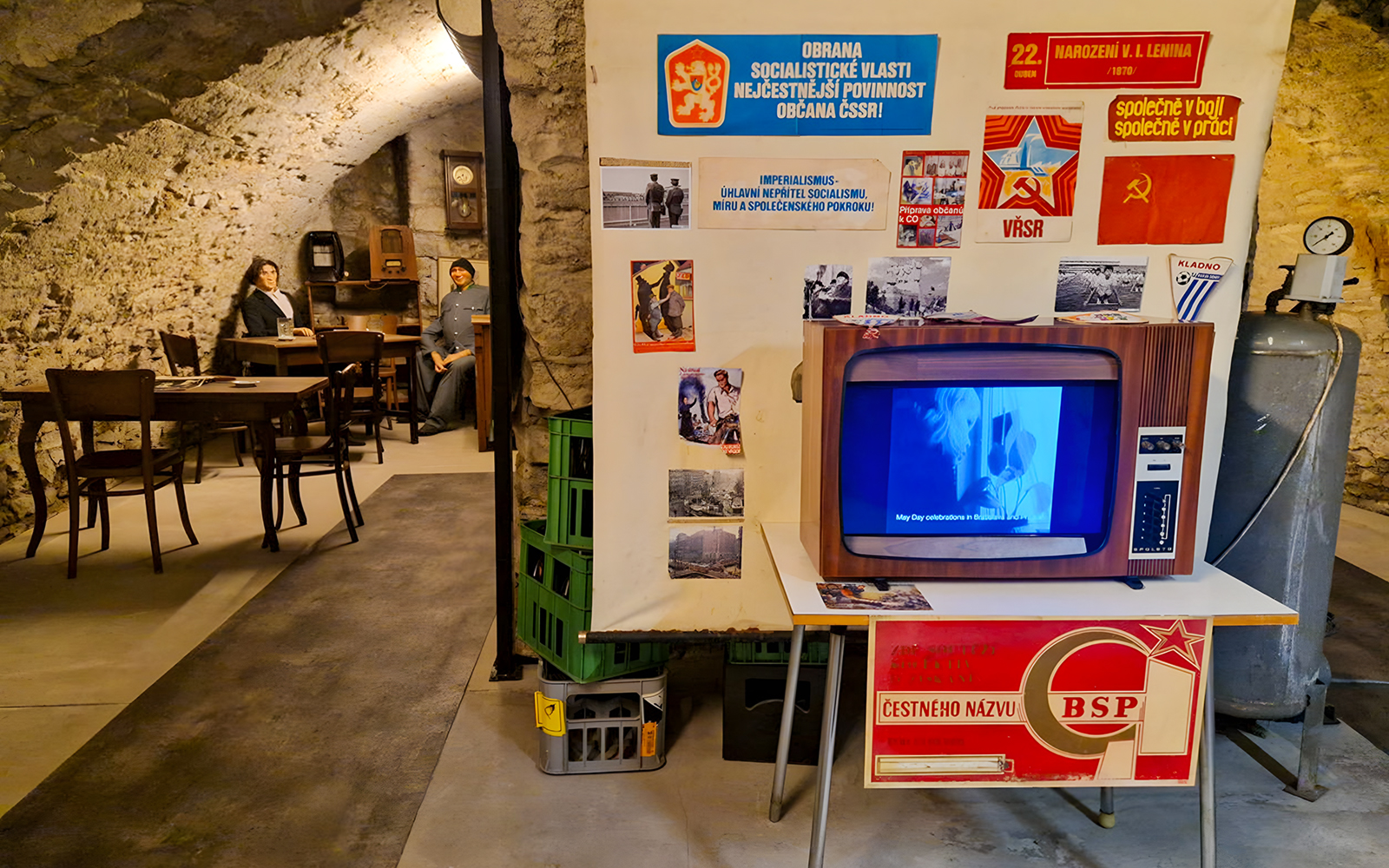 Prague Beer Museum interior with vintage TV and historical posters.