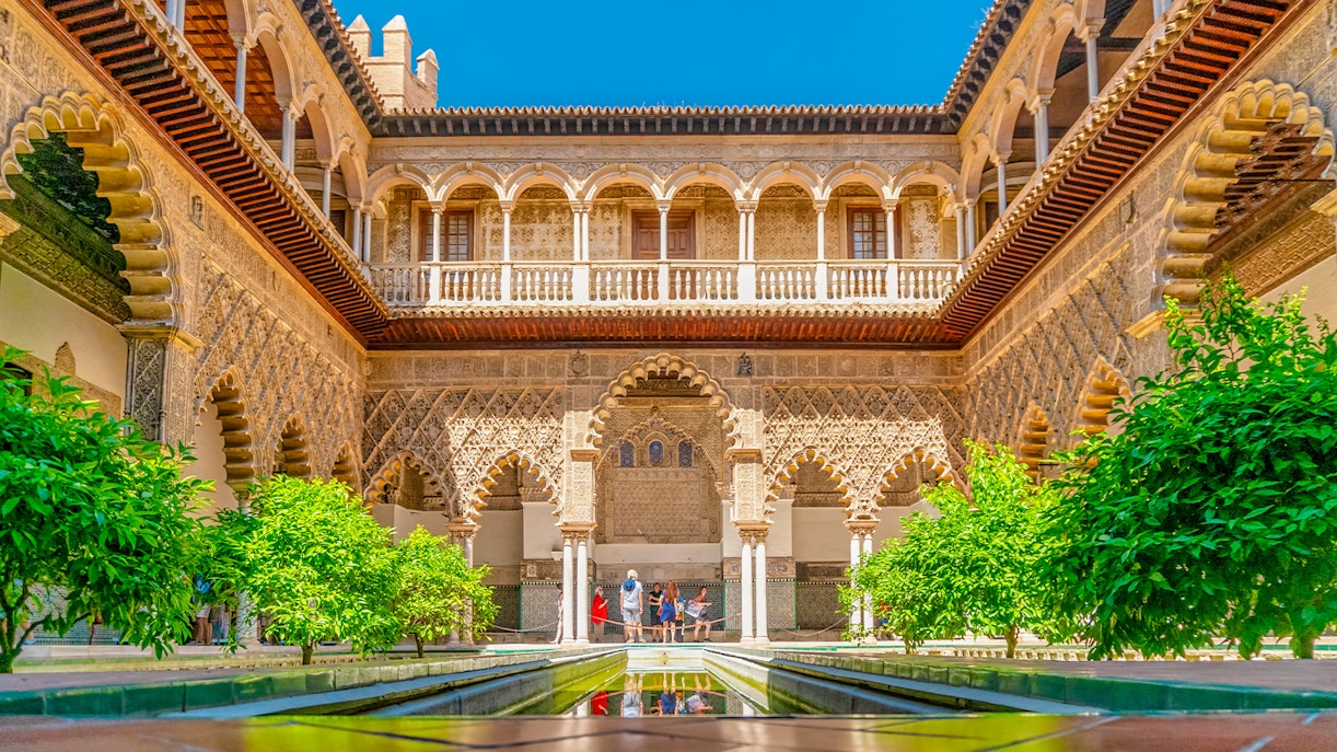 Real Alcazar Seville Moorish architecture with intricate arches and detailed stonework.
