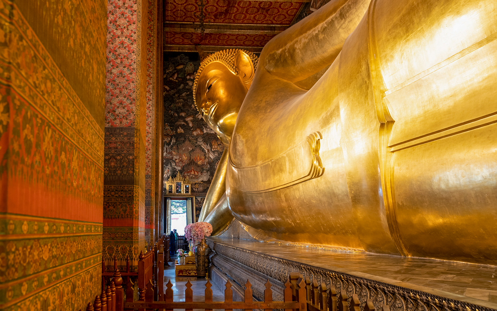 Reclining Buddha statue at Wat Pho, Bangkok, part of guided tour with mango dessert.