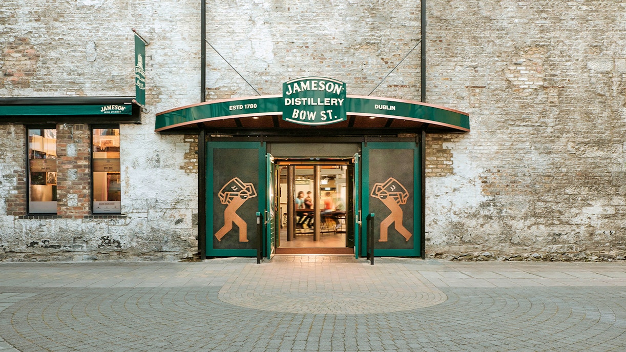 Jameson Whiskey Distillery exterior in Dublin with visitors entering for a guided tour.