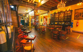 Rio Scenarium interior with vintage decor and dining area, Rio de Janeiro.