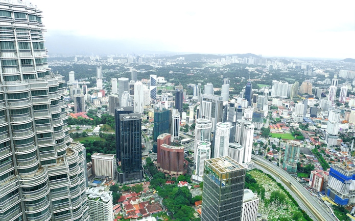 View of Kuala Lumpur skyline from Petronas Twin Towers observation deck.