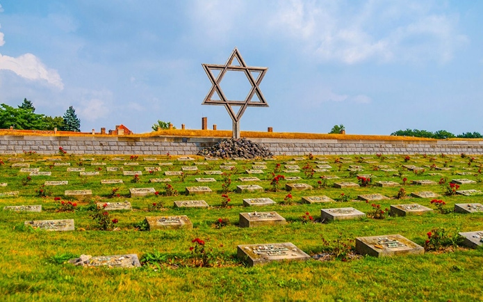 Terezin concentration camp cemetery with Star of David memorial.