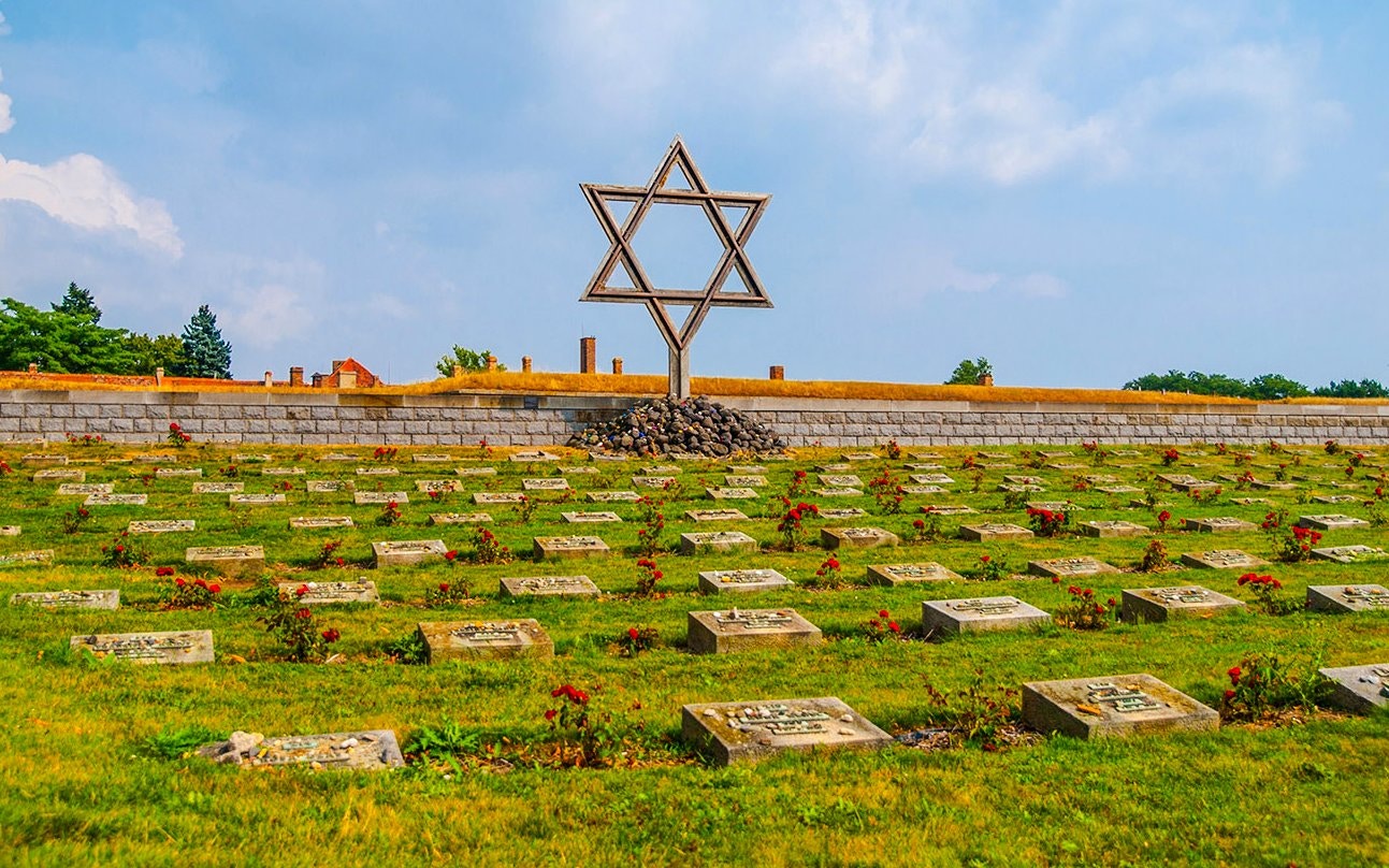 Terezin concentration camp cemetery with Star of David memorial.