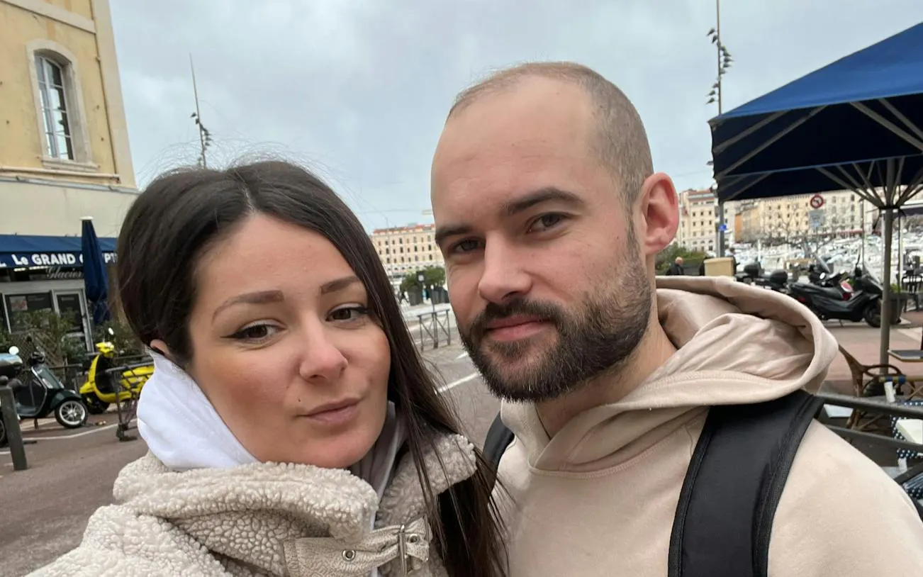 Couple exploring Marseille streets during a self-guided murder mystery game.