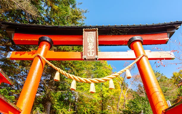 Torii gate with rope detail in autumn, leading to Chureito Pagoda, Arakura, Japan.