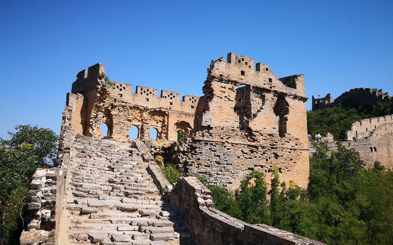 Mutianyu Great Wall section with stone steps and ancient watchtower in Beijing, China.