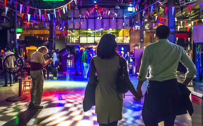 Couple exploring interactive exhibits at the Exploratorium in San Francisco.