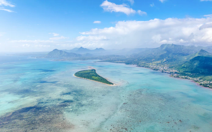 Aerial view of lagoon surrounding Île aux Bénitiers Island, Mauritius.