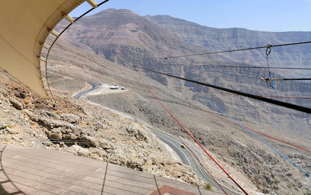 Jebel Jais zipline cables stretching over rocky mountain landscape in Ras Al Khaimah, UAE.