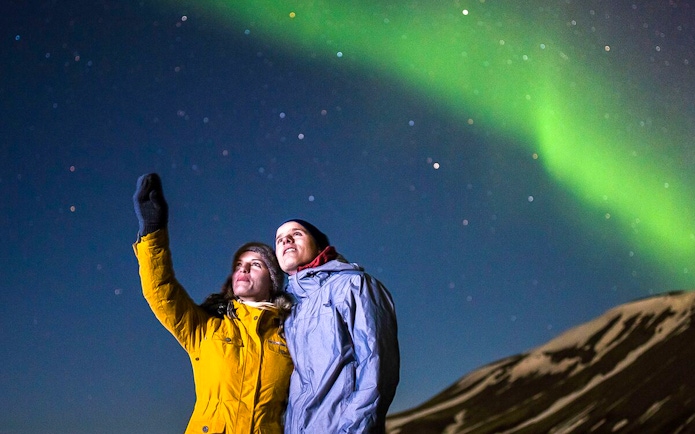 Guests viewing northern lights on Premium Northern Lights Super Jeep Tour.