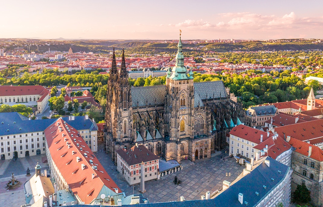 Tourists exploring Prague Castle on a guided tour in Prague, Czech Republic.