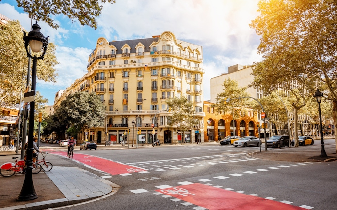 Tourists exploring Barcelona street near the Picasso Museum on a walking tour.