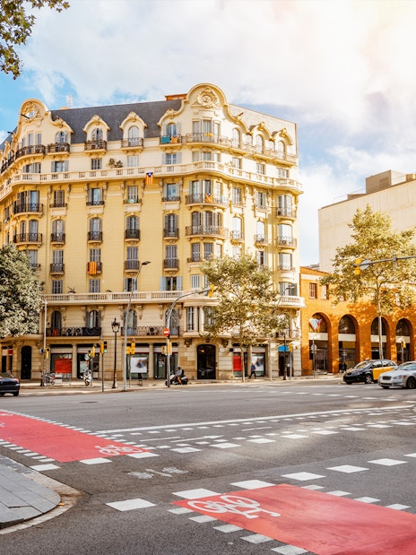 Tourists exploring Barcelona street near the Picasso Museum on a walking tour.