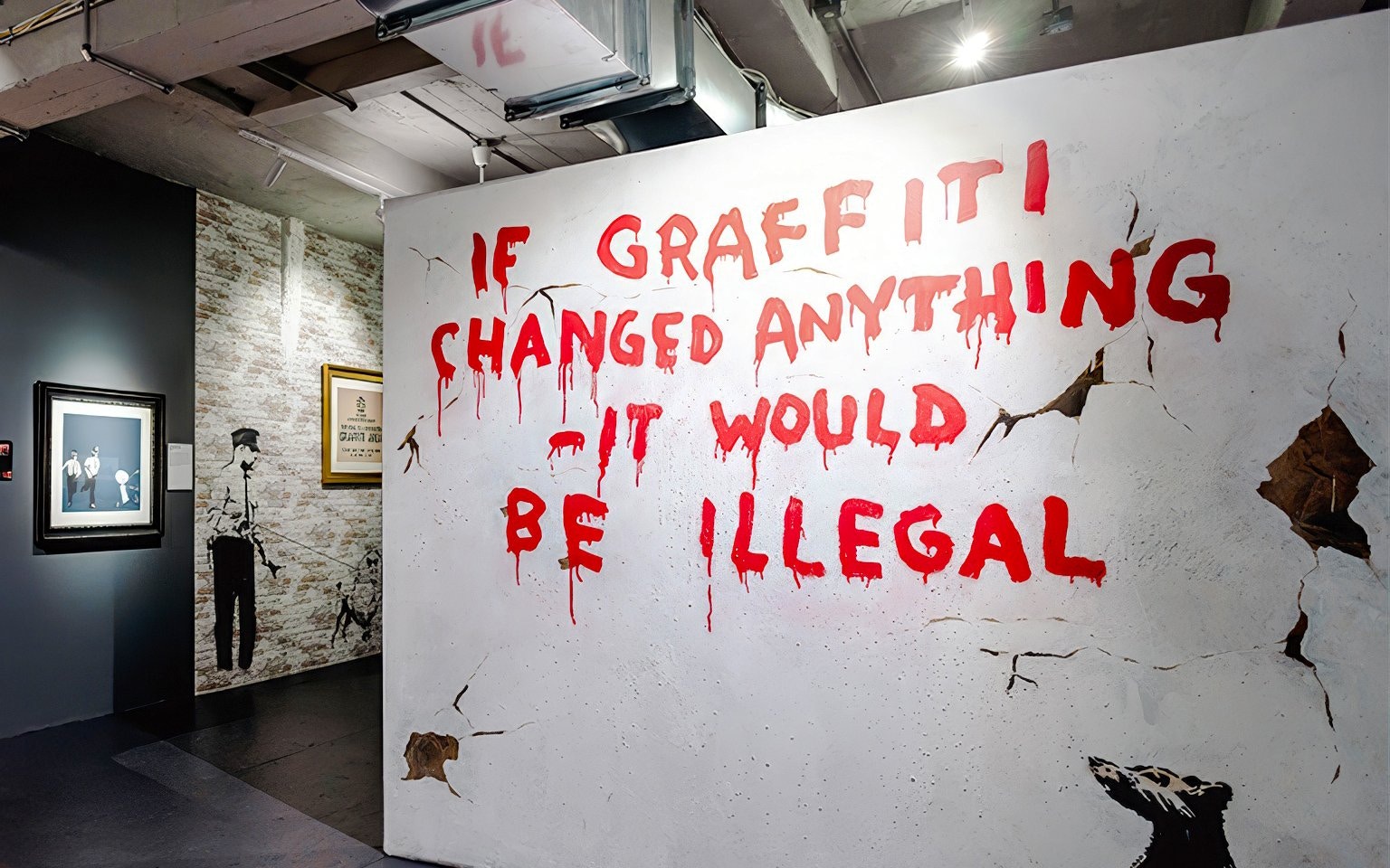 Graffiti art with text "If graffiti changed anything it would be illegal" at The Banksy Museum.