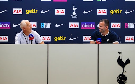 Two men at a press conference table with Tottenham Hotspur branding in the background.