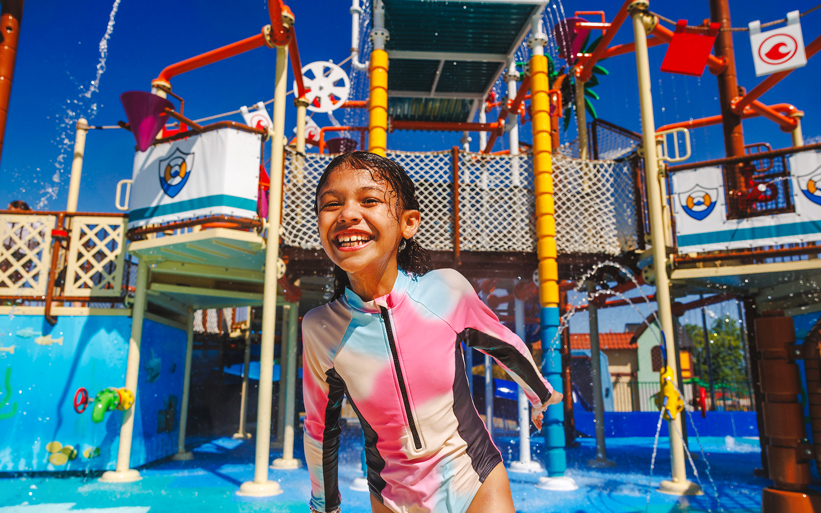 Child enjoying water playground at Legoland New York.
