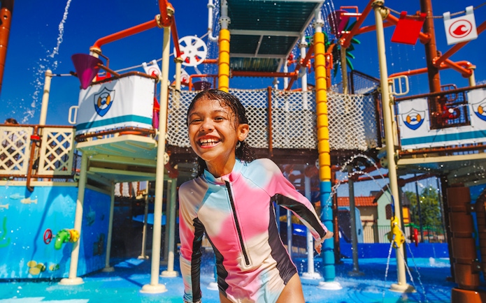 Child enjoying water playground at Legoland New York.