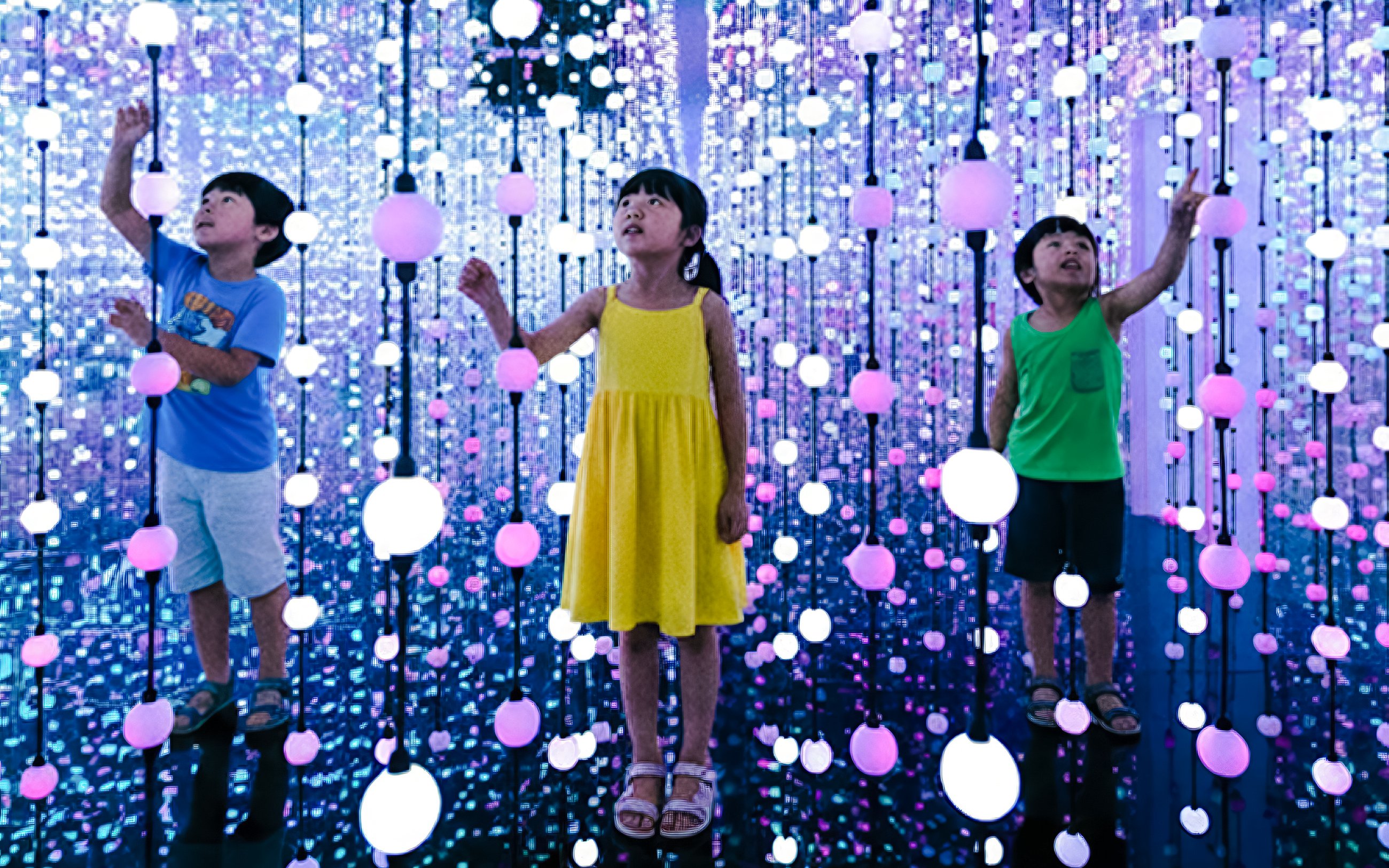 Children exploring interactive light display at Dopamine Land multisensory experience.