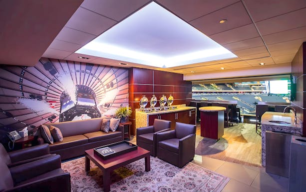 Luxury suite interior at Madison Square Garden with arena view.