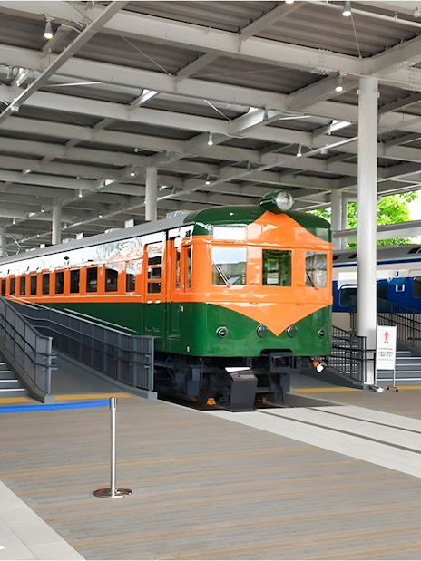 Historic trains and a Shinkansen exhibit at Kyoto Railway Museum.