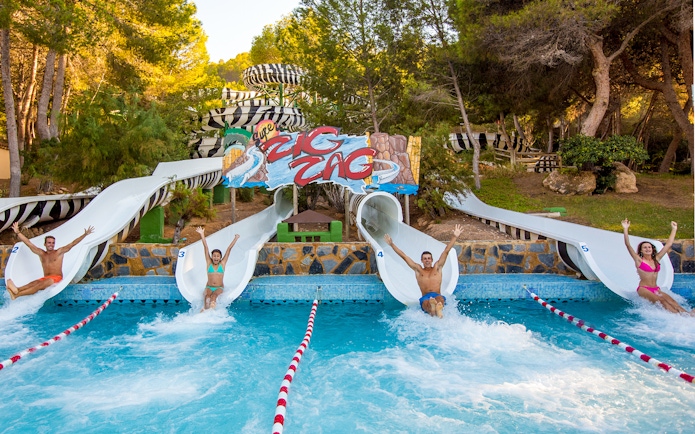 People sliding down water slides at Aqualand Costa Adeje, Tenerife.