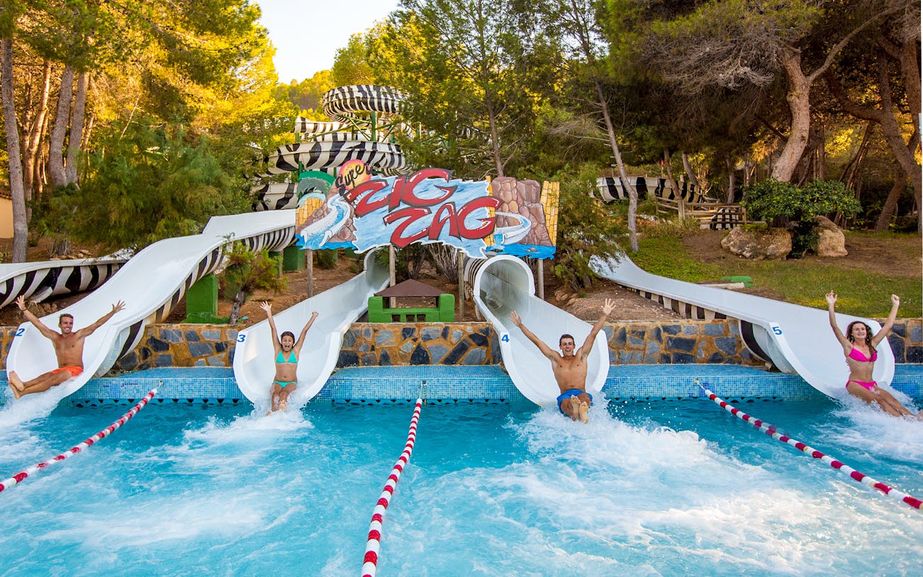 People sliding down water slides at Aqualand Costa Adeje, Tenerife.