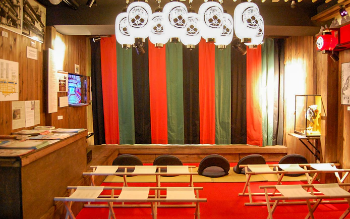 Seating area inside Osaka Dotonbori Museum Namikiza with traditional decor.