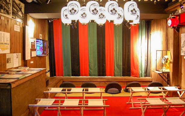 Seating area inside Osaka Dotonbori Museum Namikiza with traditional decor.