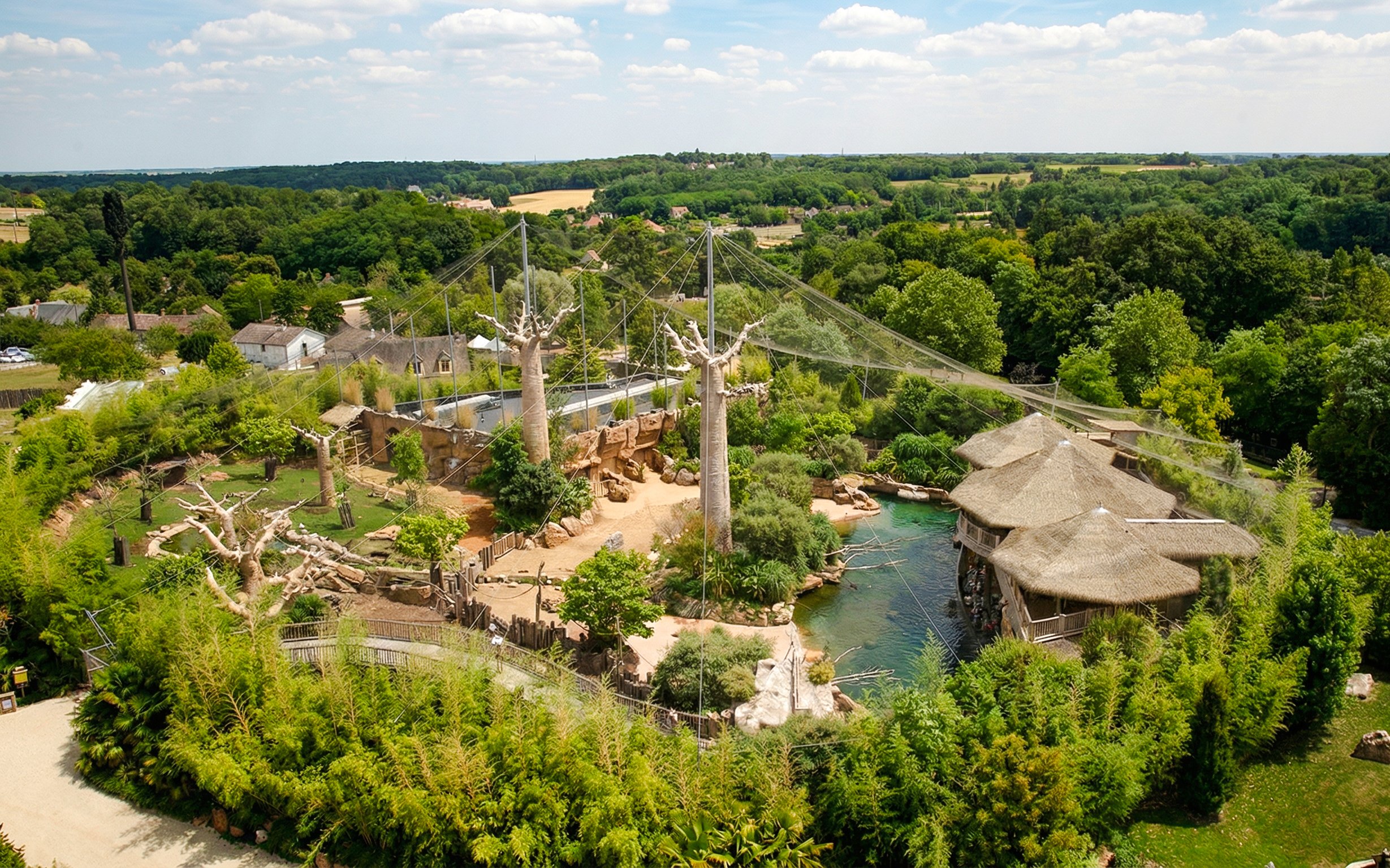 Zooparc de Beauval aerial view with lush greenery and animal enclosures, Loire Valley, France.