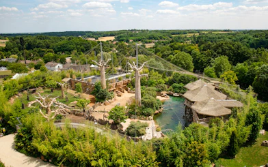 Zooparc de Beauval aerial view with lush greenery and animal enclosures, Loire Valley, France.
