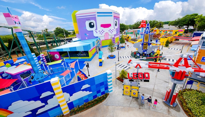The LEGO MOVIE World entrance at Legoland Florida with colorful attractions and rides.