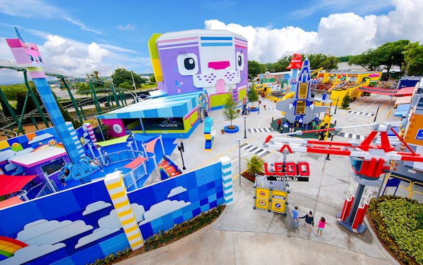 The LEGO MOVIE World entrance at Legoland Florida with colorful attractions and rides.