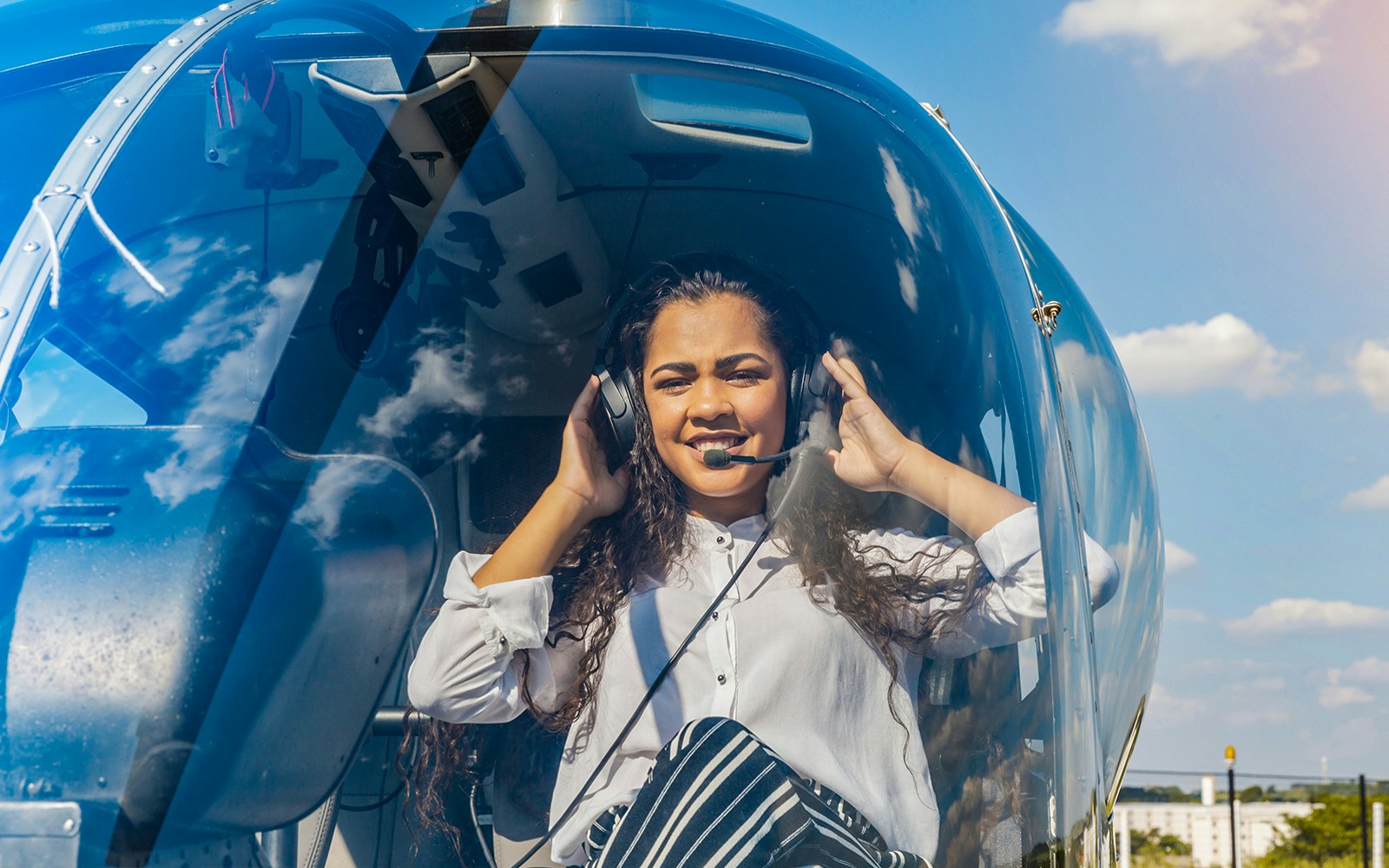 Person inside helicopter preparing for Venice lagoon tour.